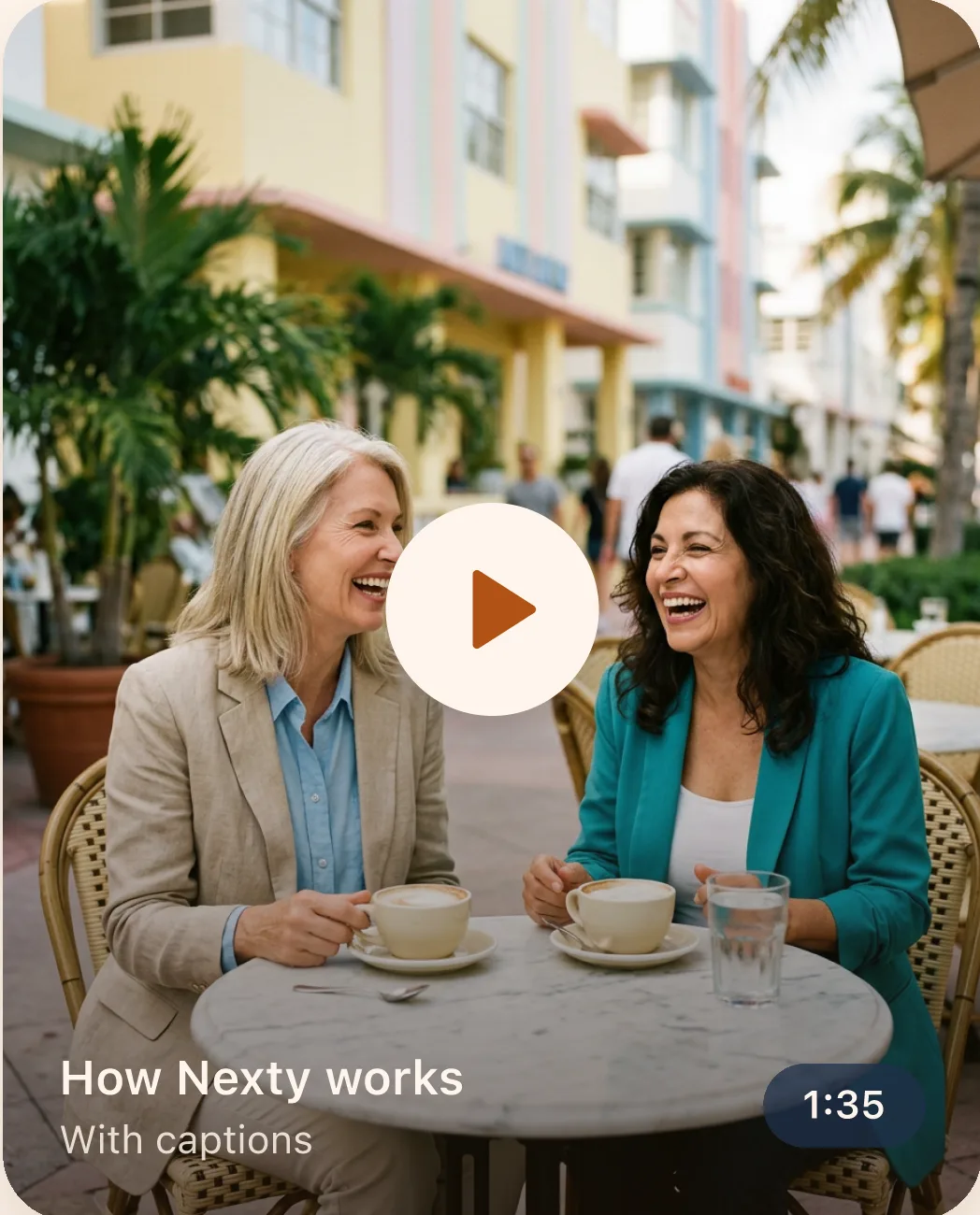 Two friends laughing over coffee at an outdoor café
